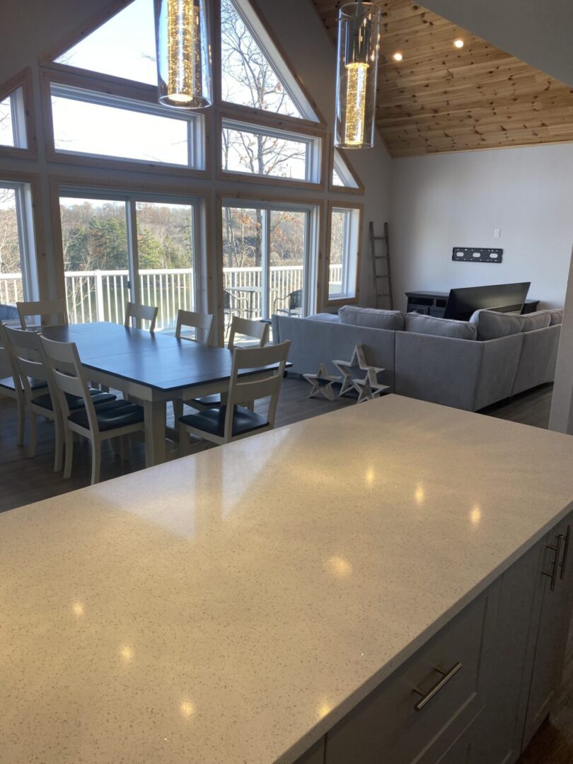 Modern kitchen with a large island and open living room.